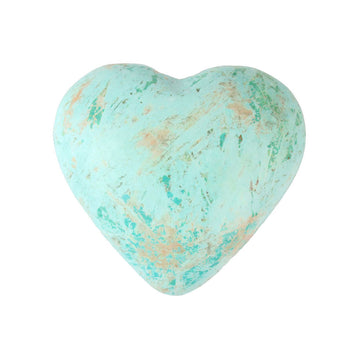 Front view of polished turquoise heart crystal on a white background.